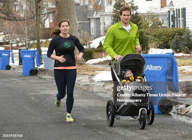 Kristi and Nathaniel Doro of Albany run with their 16-month-old daughter Vita on Lenox Ave. On Thursday, Feb. 15, 2018 in Albany, N.Y. Nathaniel was...