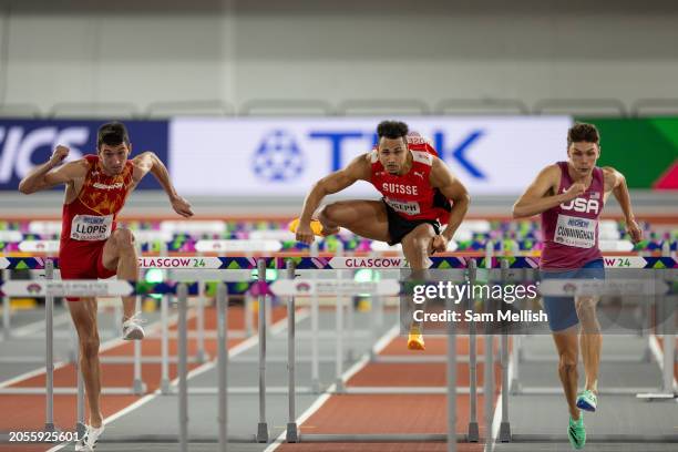 Enrique Llopis of Spain, Jason Joseph of Switzerland and Trey Cunningham of the United States compete in the Mens 60 Metres Hurdles Semi Final during...