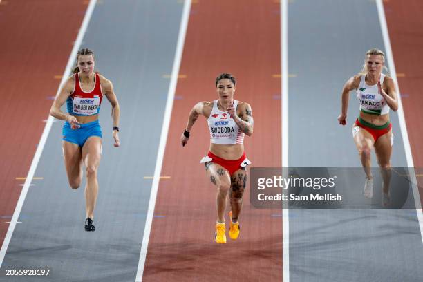 Patrizia Van Der Weken of Luxembourg, Ewa Swoboda of Poland and Boglarka Takacs of Hungray compete in the Women's 60m Semi Final during day two of...