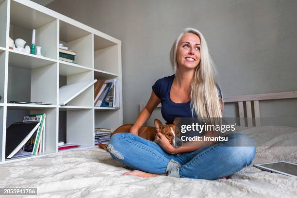 Young Beautiful Woman With A Dog High-Res Stock Photo