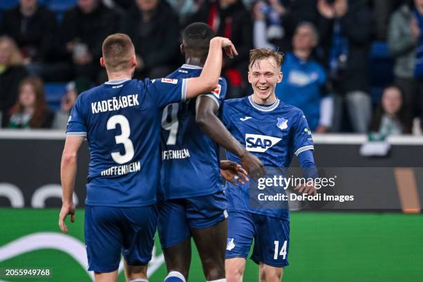 Maximilian Beier of TSG 1899 Hoffenheim celebrates after scoring his team's second goal with teammates during the Bundesliga match between TSG...