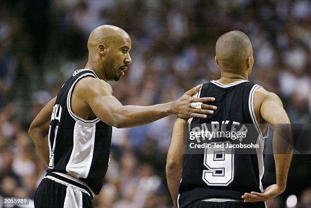 Bruce Bowen talks with teammate Tony Parker of the San Antonio Spurs in Game six of the Western Conference Finals during the 2003 NBA Playoffs...