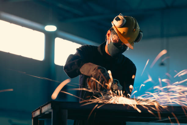 Someone welding in a dark room