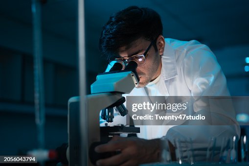 Young Caucasian scientist working in the Laboratory Young Caucasian scientist working in the Laboratory