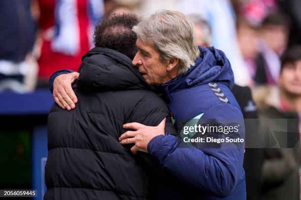 Diego Pablo Simeone head coach of Atletico de Madrid greets Manuel Pellegrini head coach of Real Betis prior to the LaLiga EA Sports match between...