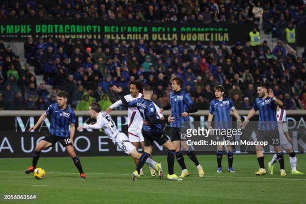 Alexis Saelemaekers of Bologna FC is upended by Teun Koopmeiners of Atalanta resulting a penalty for the visitors during the Serie A TIM match...