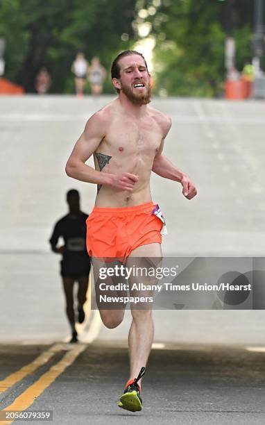 Eric McKnight of Ballston Spa crosses the finish line in second place during the CDPHP Workforce Team Challenge 5K on Thursday, May 17, 2018 in...