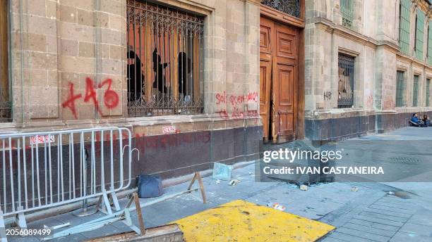 View of the destruction caused by demonstrators at the presidential palace in Mexico City on March 6 during a protest over the disappearance of the...