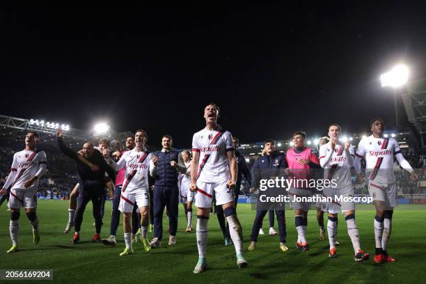 The Bologna FC team celebrates the 2-1 victory in front of fans following the final whistle of the Serie A TIM match between Atalanta BC and Bologna...