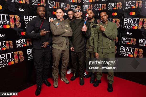 Ed Skrein and CASISDEAD pose with the Hip Hop/Rap/Grime Act Award during the BRIT Awards 2024 at The O2 Arena on March 02, 2024 in London, England.