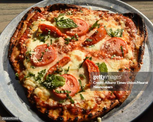 Margherita grilled artisan pizza with house red sauce, buffalo mozzarella, grana padano, and basil at Daley's on Yates on Thursday, Aug. 30, 2018 in...