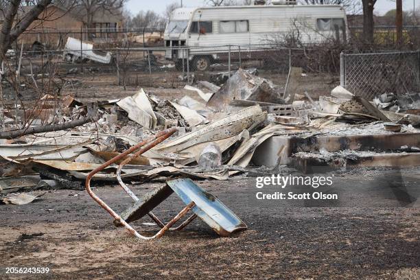 Lawn chair sits in front of a leveled home in the aftermath of the Smokehouse Creek fire on March 03, 2024 in Stinnett, Texas. The fire has burned...