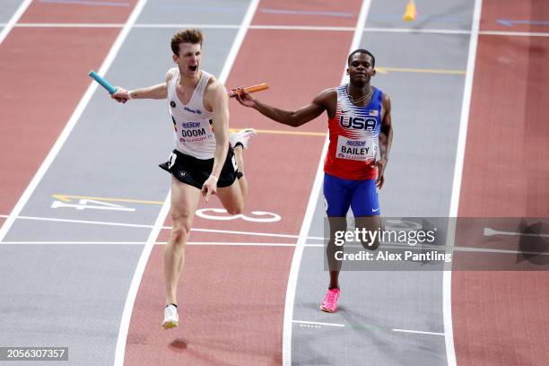 Gold medalist Alexander Doom of Team Belgium celebrates ahead of silver medalist Christopher Bailey of Team United States after crossing the finish...