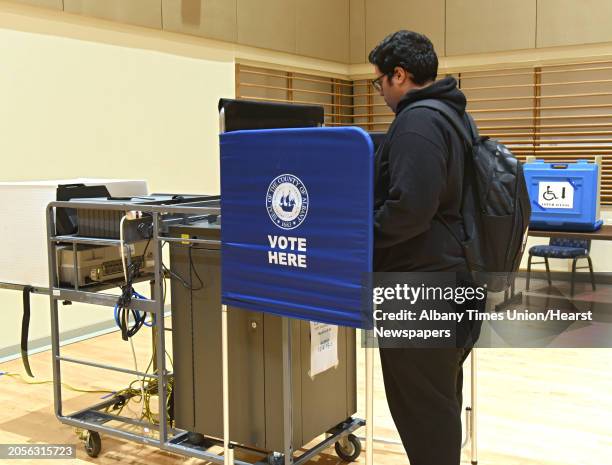 Junior Bryan Torres of the Bronx votes in the multi-purpose room at University at Albany on election night on Tuesday, Nov. 6, 2018 in Albany, N.Y.