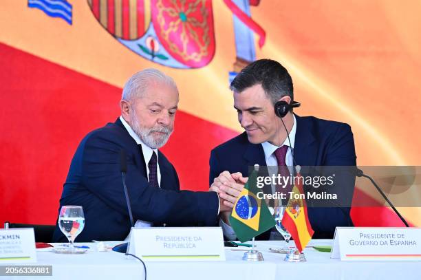 President of Brazil Luiz Inácio Lula da Silva greets Prime Minister of Spain Pedro Sanchez during a meeting with Brazilian and Spanish businessmen at...