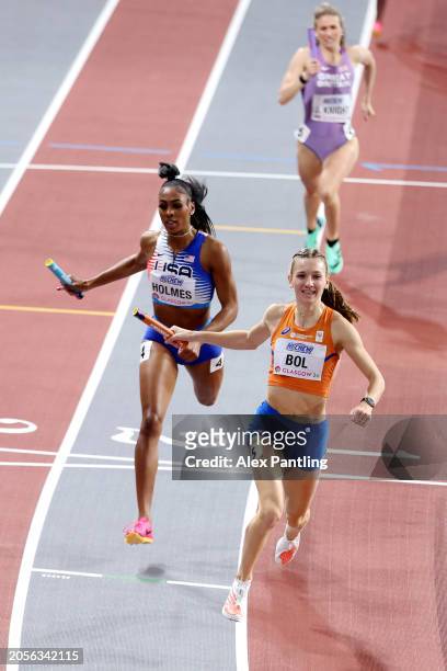 Gold medalist Femke Bol of Team Netherlands crosses the line ahead of silver medalist Alexis Holmes of Team United States during the Women's 4x400...