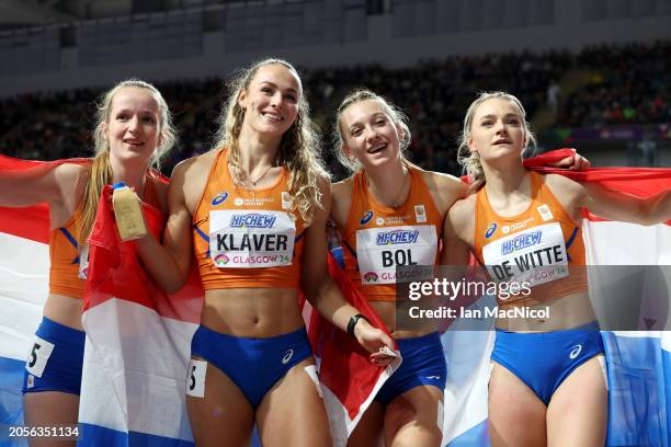 Gold medalists Cathelijn Peeters, Lieke Klaver, Femke Bol and Lisanne De Witte of Team Netherlands pose for a photo after winning in the Women's...