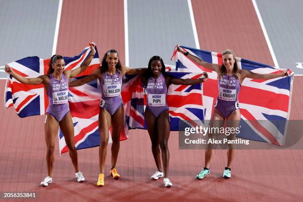 Bronze medalists Laviai Nielsen, Lina Nielsen, Ama Pipi and Jessie Knight of Team Great Britain pose for a photo after the Women's 4x400 Metres Relay...