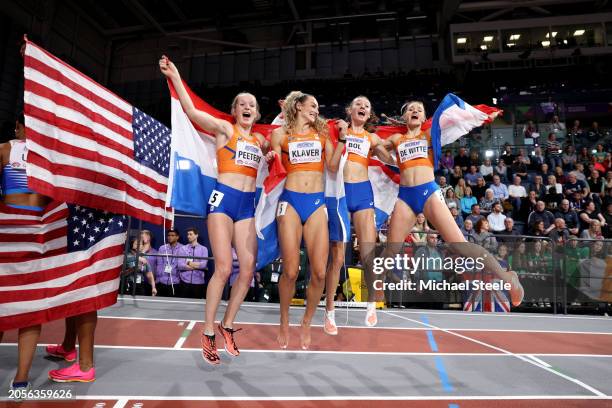 Gold medalists Cathelijn Peeters, Lieke Klaver, Femke Bol and Lisanne De Witte of Team Netherlands pose for a photo after winning in the Women's...