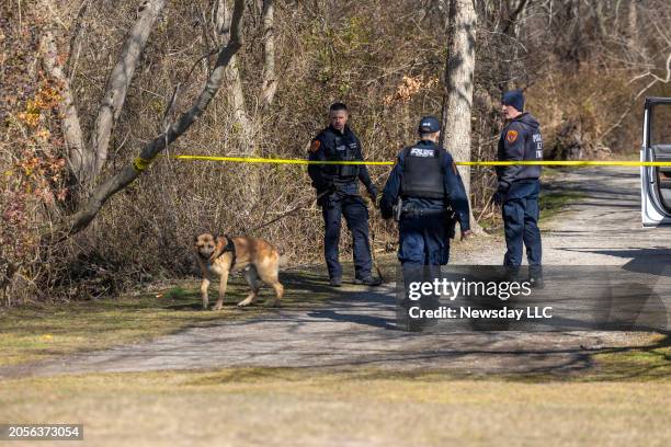 Suffolk County Police K9 units search Southards Pond Park on on Mar. 1, 2024 in Babylon, New York where human remains had been discovered.