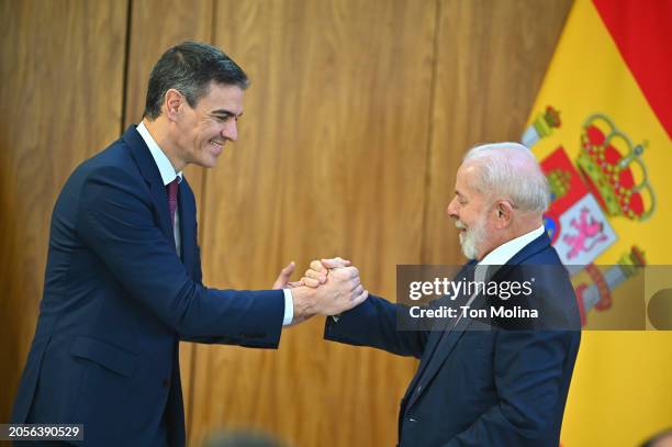 President of Brazil Luiz Inácio Lula da Silva and Prime Minister of Spain Pedro Sanchez shake hands during a press conference at the Planalto Palace...