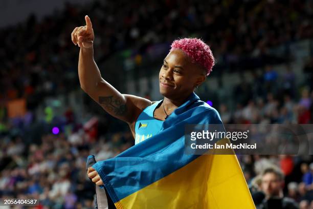 Devynne Charlton of Team Bahamas gestures after winning and setting a new world record in the Women's 60 Metres Hurdles Final on Day Three of the...
