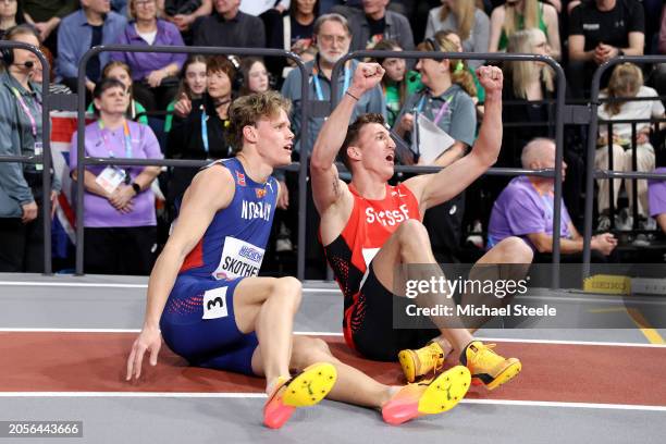 Silver medalist Sander Skotheim of Team Norway and gold medalist Simon Ehammer of Team Switzerland react after the 1000 Metres leg in the Heptathlon...