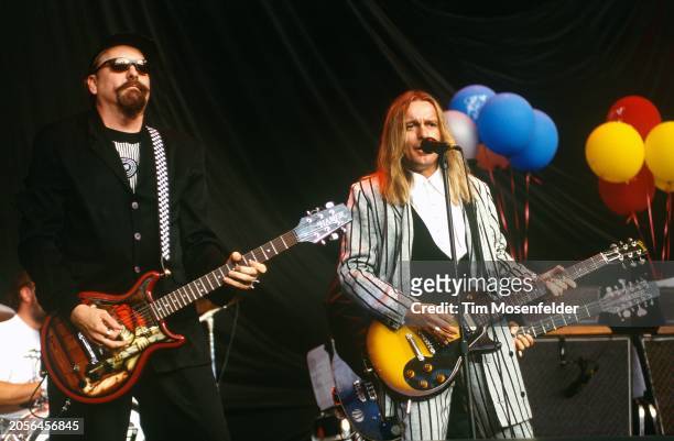 Rick Neilsen and Robin Zander of Cheap Trick perform at Shoreline Amphitheatre on August 17, 1994 in Mountain View, California.