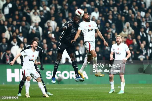 Kerem Demirbay of Galatasaray in action with Omar Colley of Besiktas during the Turkish Super League match between Besiktas and Galatasaray at...
