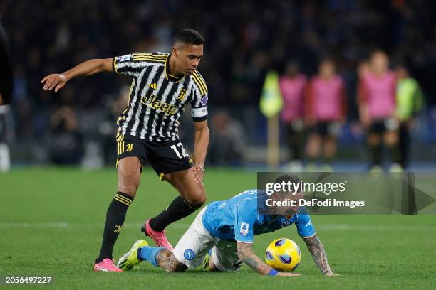 Alex Sandro of Juventus FC and Matteo Politano of SSC Napoli battle for the ball during the Serie A TIM match between SSC Napoli and Juventus - Serie...