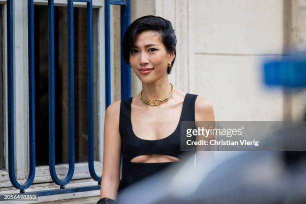 Molly Chiang wears black cut out dress, golden necklace outside Valentino during the Womenswear Fall/Winter 2024/2025 as part of Paris Fashion Week...
