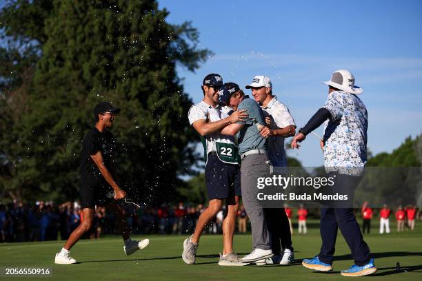 Mason Andersen of the United States celebrates with his team after winning on the 18th hole during the final round of the 117 Visa Argentina Open...