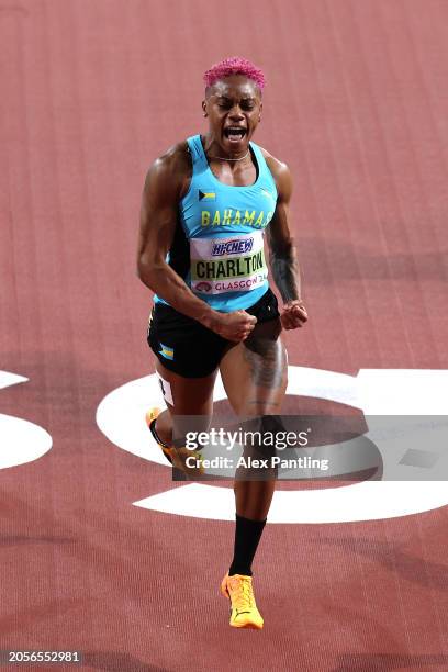 Gold medalist Devynne Charlton of Team Bahamas celebrates after crossing the finish line to win and set a new world record in the Women's 60 Metres...