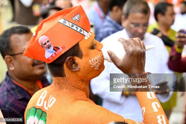 Bharatiya Janata Party supporter paints his body during Narishakti Vandana Rally where Prime Minister Narendra Modi will address at Barasat on March...