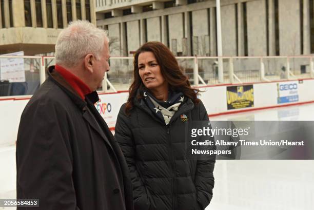 Two-time Olympic figure skating medalist Nancy Kerrigan talks to her husband Jerry Solomon before speaking at a special appearance at the Empire...