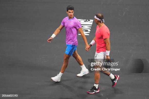 Carlos Alcaraz and Rafael Nadal in action during The Netflix Slam at Michelob ULTRA Arena on March 03, 2024 in Las Vegas, Nevada.