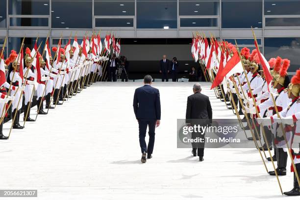 Spanish Prime Minister Pedro Sanchez walks to meet with Brazil's President Luiz Inácio Lula da Silva at the Planalto Palace on March 6, 2024 in...