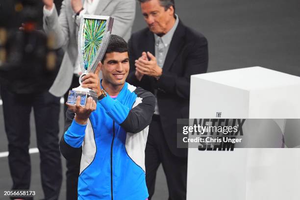 Carlos Alcaraz poses with the trophy at The Netflix Slam at Michelob ULTRA Arena on March 03, 2024 in Las Vegas, Nevada.