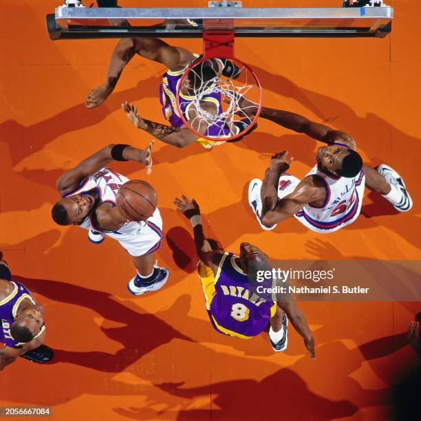 John Wallace of the New York Knicks shoots against Kobe Bryant of the Los Angeles Lakers at Madison Square Garden on November 5, 1996 in Abu Dhabi,...