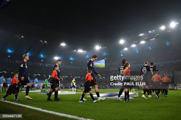 Copenhagen team walk out ahead of the UEFA Champions League round of 16, second-leg, football match between Manchester City and FC Copenhagen at the...