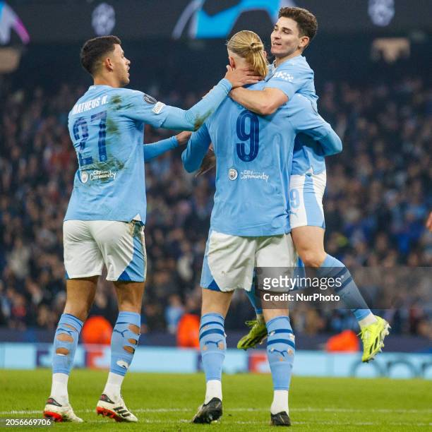 Erling Haaland, wearing the number 9 jersey for Manchester City, is celebrating his goal with teammates during the UEFA Champions League Round of 16...