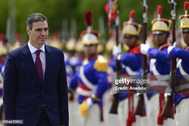 Spain's Prime Minister Pedro Sanchez reviews the honour guard before a meeting with Brazil's President Luiz Inacio Lula da Silva at the Planalto...