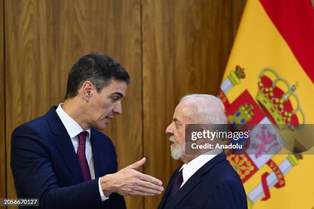 Brazil's President Luiz Inacio Lula da Silva and Spain's Prime Minister Pedro Sanchez react as they meet at the Planalto Palace in Brasilia, Brazil...