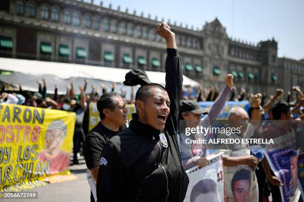 Students take part in a protest over the disappearance of the 43 students of the Ayotzinapa teaching training school in 2014 in front of the Palacio...