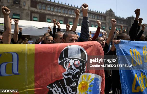 Students take part in a protest over the disappearance of the 43 students of the Ayotzinapa teaching training school in 2014 in front of the Palacio...