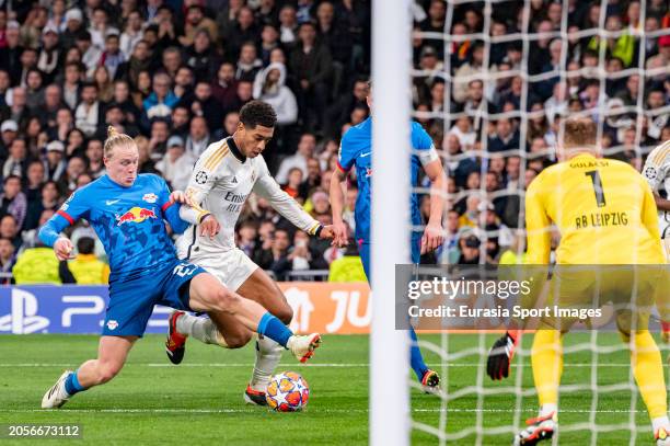 Jude Bellingham of Real Madrid in action with the ball against Xaver Schlager and Peter Gulacsi of RB Leipzig during the UEFA Champions League...