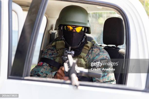 Soldier stands guard at the Port-au-Prince international airport after armed gang members exchanged gunfire with police and soldiers around the...