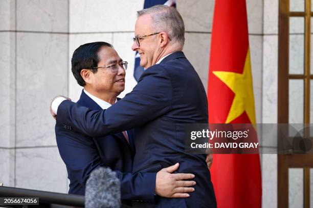 Vietnam Prime Minister Pham Minh Chinh embraces Australian Prime Minister Anthony Albanese after delivering a joint statement at Parliament House in...