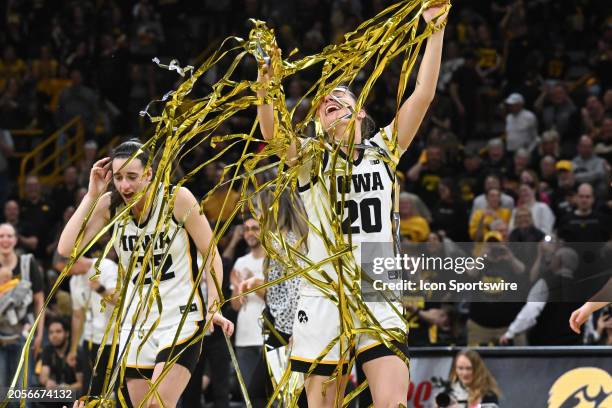 Iowa guard Kate Martin celebrates with streamers dropped during a Senior Day ceremony after a women's college basketball game between the Ohio State...