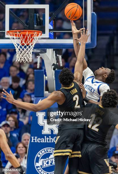 Adou Thiero of the Kentucky Wildcats shoots the ball against Ven-Allen Lubin of the Vanderbilt Commodores during the first half at Rupp Arena on...